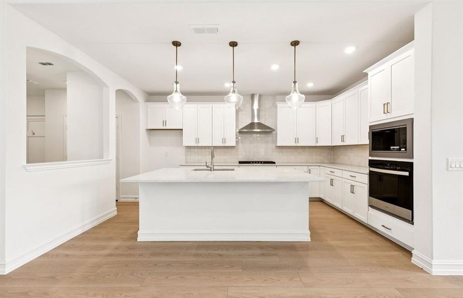 Spacious kitchen with eat-in bartop island