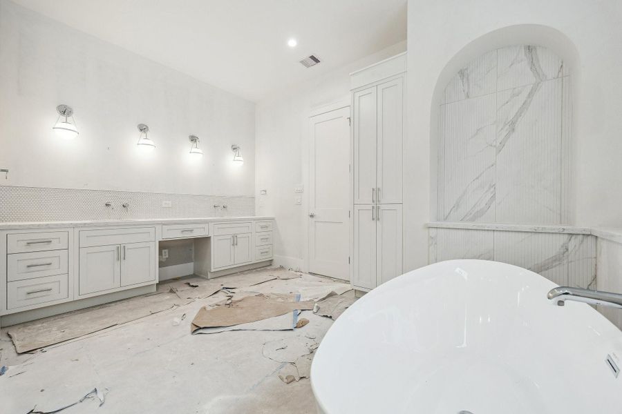 The current stage of construction as of January 20th, 2026.  Estimated Completion February/March 2026.  This home is almost done!.  Open shelving in the alcove wall will hold neatly stacked towels, jars, and bath accessories.