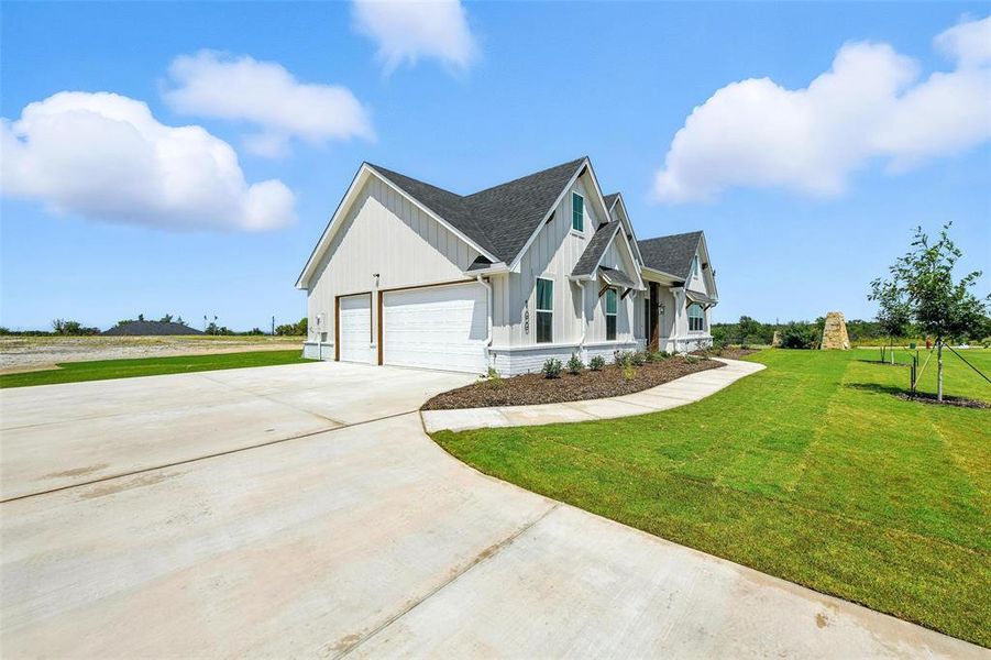 Front exterior of a new home in Rocky Top Ranch, Reno, TX, highlighting curb appeal (Image 2). Front exterior of a new home in Rocky Top Ranch, Reno, TX, highlighting curb appeal (Image 2).