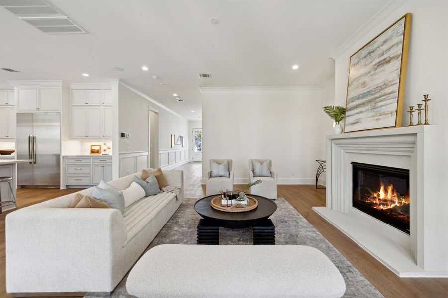 Family room looking back towards front entry and open to the incredible island kitchen.