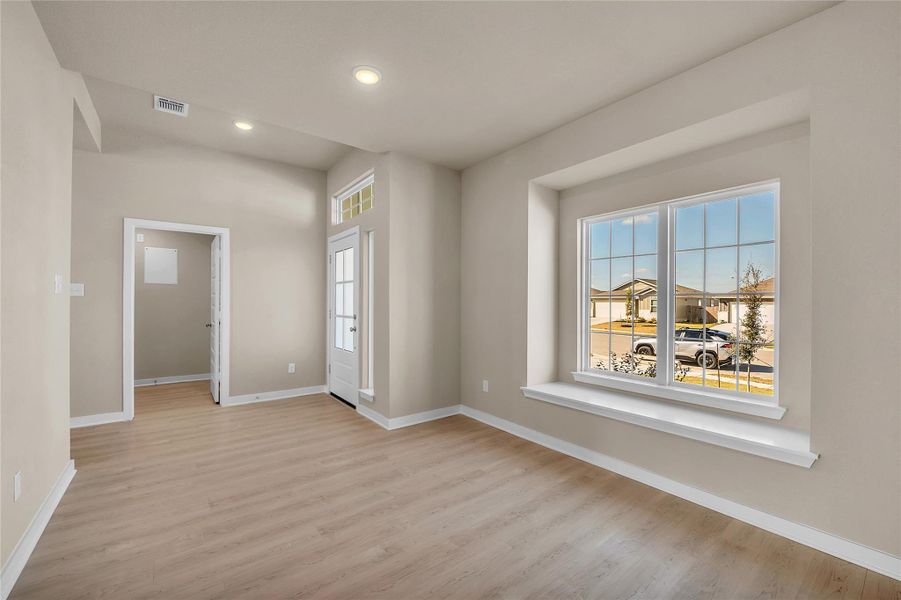 Unfurnished room with light wood-style flooring and recessed lighting