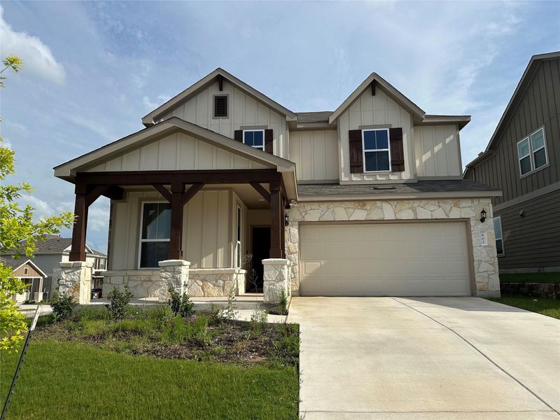 Crafted with board and batten siding and stone accents, this charming home features a welcoming covered entry. Crafted with board and batten siding and stone accents, this charming home features a welcoming covered entry.