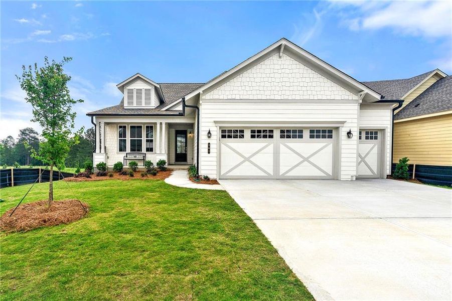 Front exterior of a new home in Cresswind Georgia at Twin Lakes, Hoschton, GA, highlighting curb appeal (Image 2).