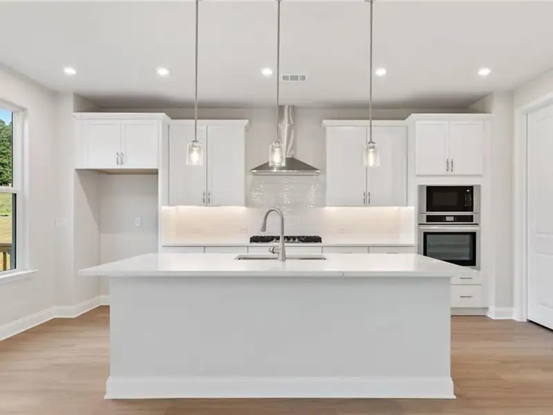 Furnished interior view inside a new home in Melody Lakeside Estates, Buford (Image 3).