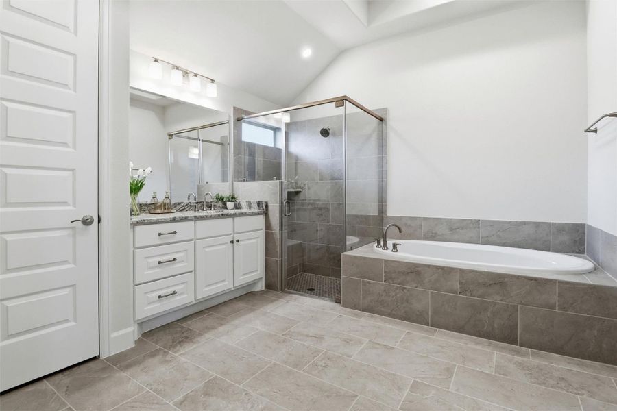 Relax and unwind in your spa-like bath. Separate sink areas, soaking tub, and walk-in closet.