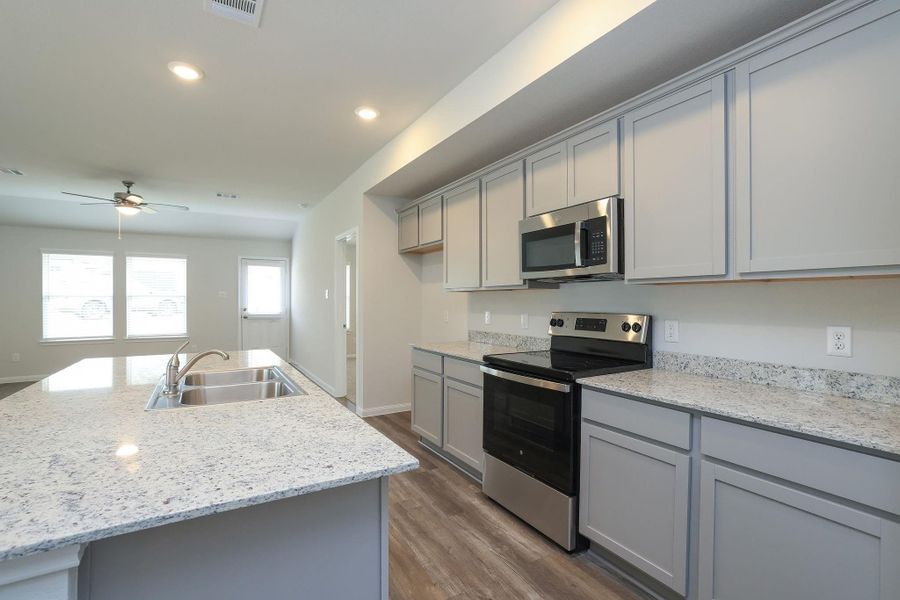 Never miss a piece of the action while you're in the Kitchen. The open concept floor plan keeps everyone connected.