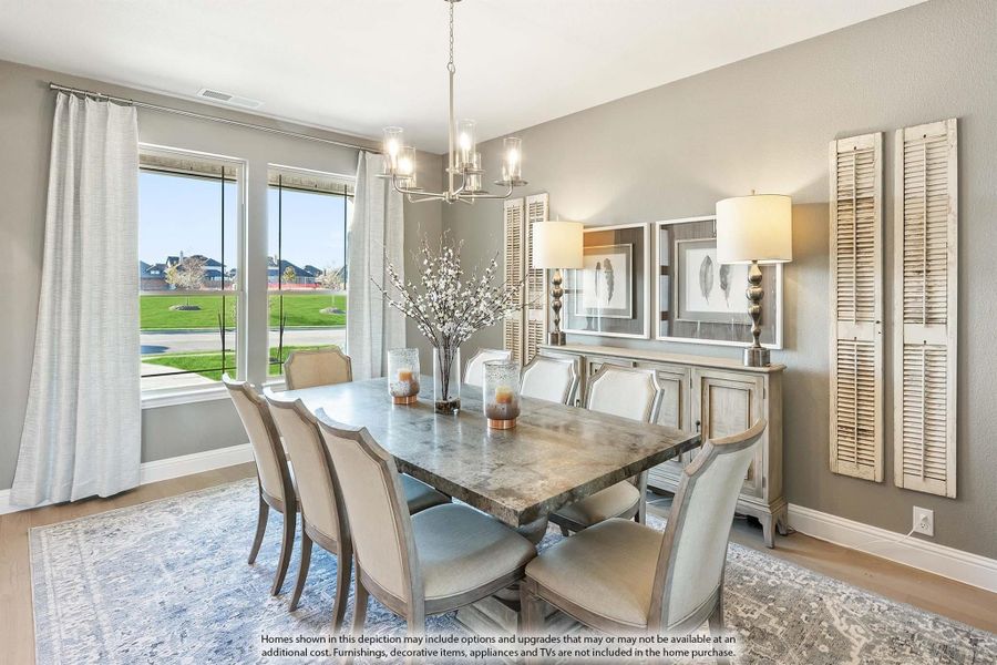 Formal dining room with stone-top table, six upholstered chairs, chandelier, and large windows overlooking a yard.