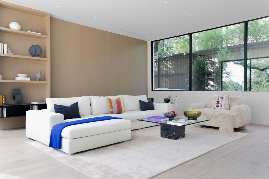 Living area featuring built in features and wood finished floors
