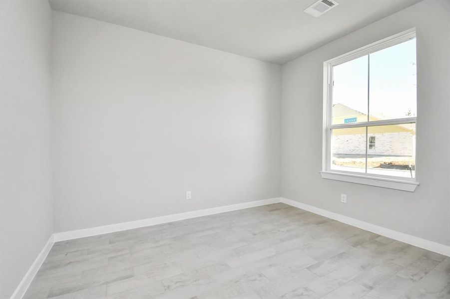 Another view of the home office space with abundant natural light.