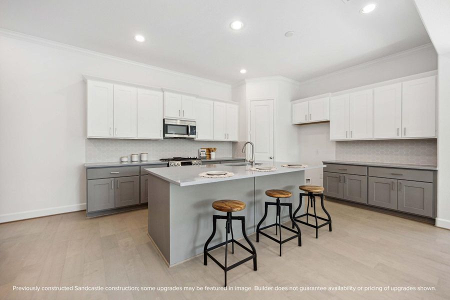 This kitchen checks every box: Benedettini cabinetry, quartz counters, included pulls, and a big island that’s perfect for everything from pancake breakfasts to wine night. This kitchen checks every box: Benedettini cabinetry, quartz counters, included pulls, and a big island that’s perfect for everything from pancake breakfasts to wine night.