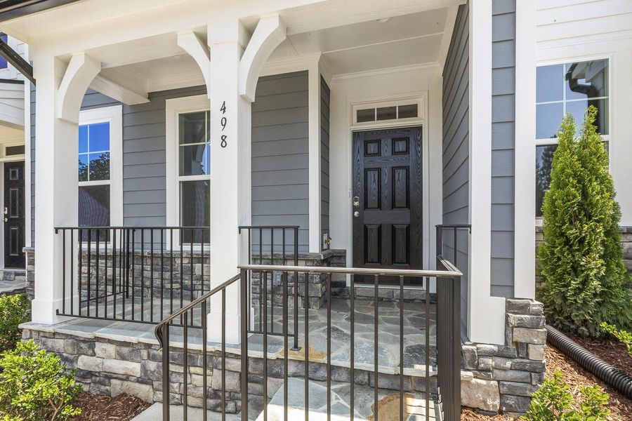 Front exterior of a new home in Enclave at Traditions Townhomes, Wake Forest, NC, highlighting curb appeal (Image 2).