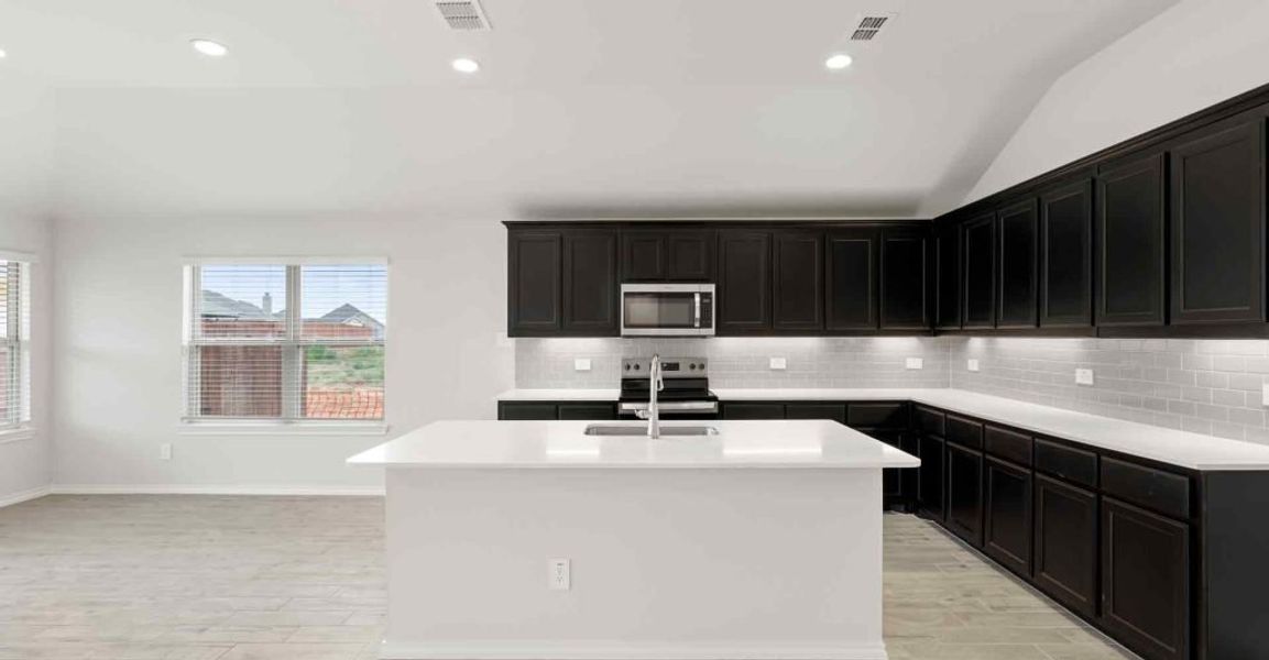 Representative exterior photo of a completed home built from the Atlanta by Impression Homes in Keeneland, Aubrey, TX (Image 4).