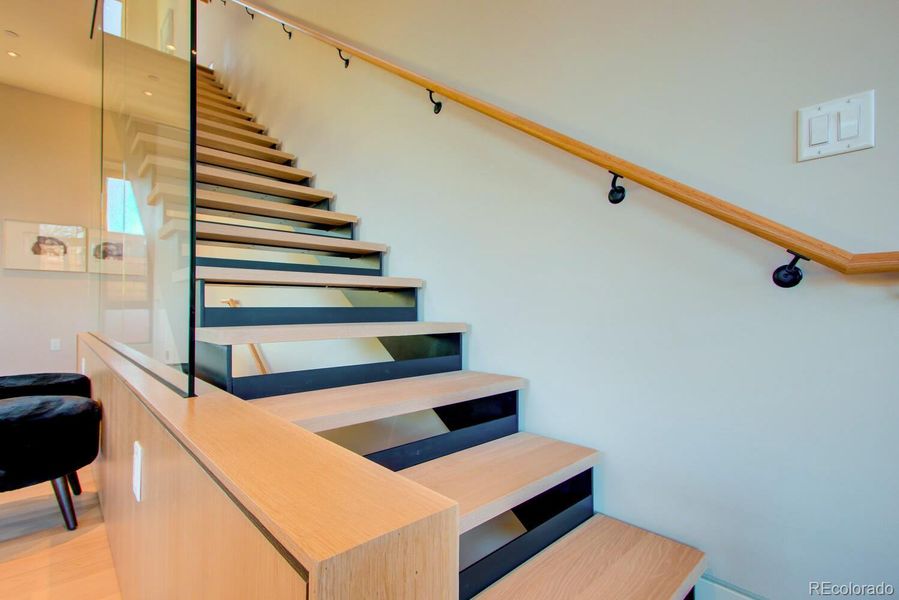 Stunning Floating staircase from Living Level to Sleeping Level. *Similar floor plan, finishes and feel at L'Avenir! (Picture is not of the actual build)