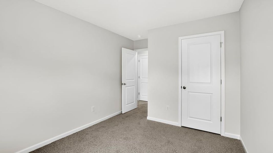 Spacious, unfurnished interior of a new home in Tanglewood Townes, Greenville (Image 26).