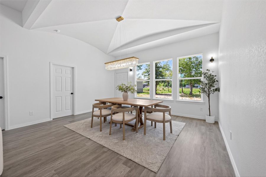 Spacious dining area ideal for hosting gatherings while overlooking the open living spaces.
