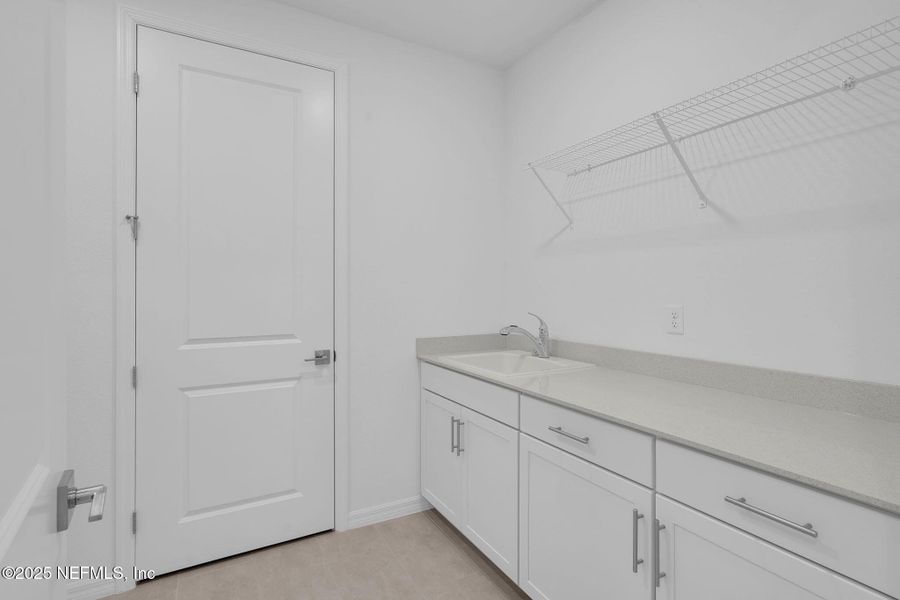 Furnished interior view inside a new home in Summer Bay at Grand Oaks, St. Augustine (Image 10).