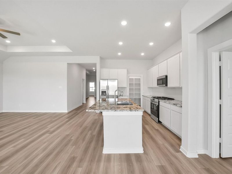 Furnished interior view inside a new home in Sunterra, Katy (Image 9).