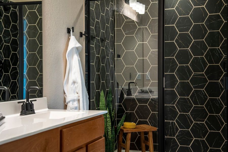 Walk-in shower with hexagon tile surround at bath 2