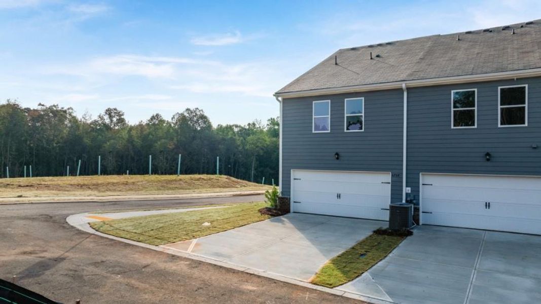 Exterior details and patio area of a home in Waypoint, Flowery Branch (Image 2).
