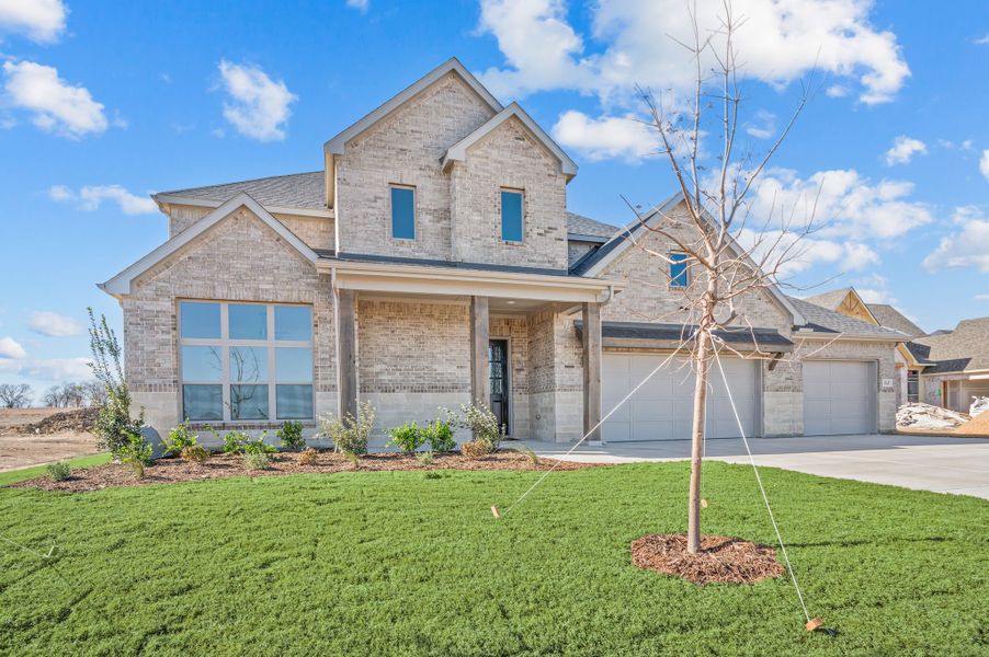 Front exterior of a new home in Settlers Glen, New Fairview, TX, highlighting curb appeal (Image 25). Front exterior of a new home in Settlers Glen, New Fairview, TX, highlighting curb appeal (Image 25).