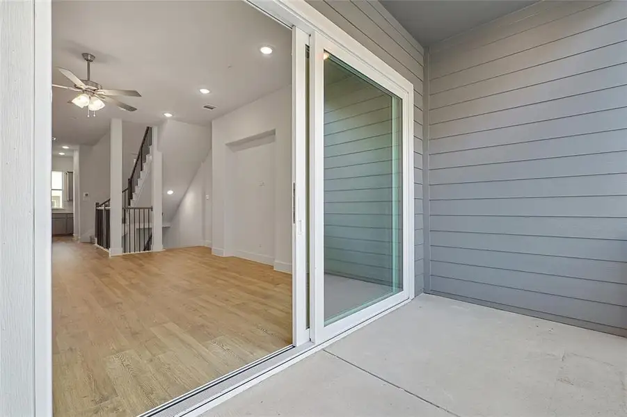 Balcony featuring a ceiling fan