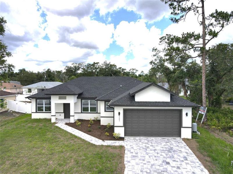 Front exterior of a new home in , North Port, FL, highlighting curb appeal (Image 14).
