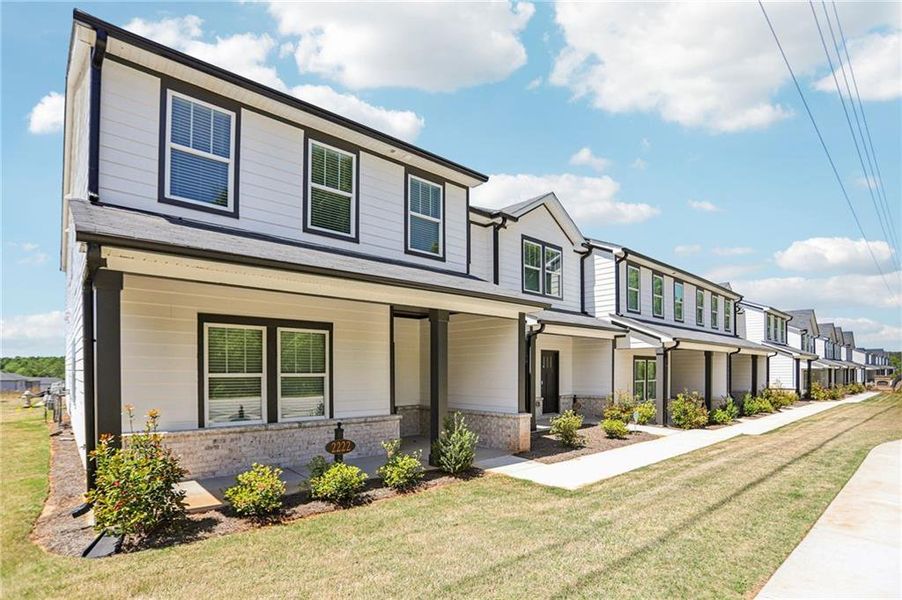 Front exterior of a new home in Avalon - Vista Series, Conyers, GA, highlighting curb appeal (Image 26).