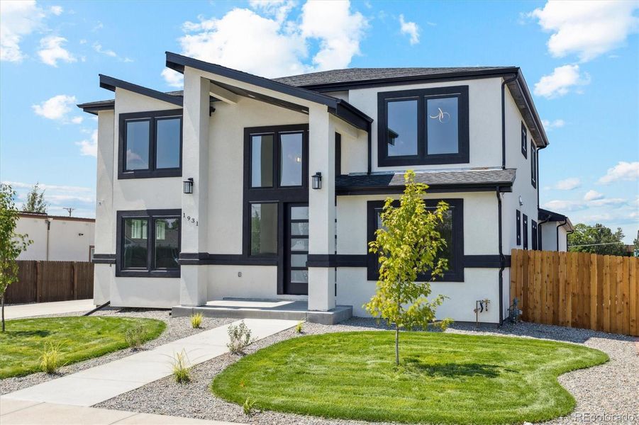 Front exterior of a new home in , Aurora, CO, highlighting curb appeal (Image 2).