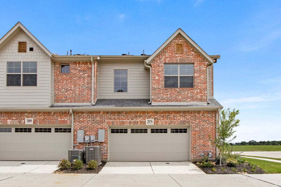 Front exterior of a new home in The Tribute, The Colony, TX, highlighting curb appeal (Image 26). Front exterior of a new home in The Tribute, The Colony, TX, highlighting curb appeal (Image 26).