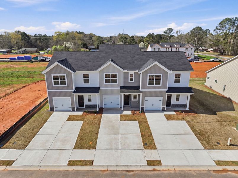 Front exterior of a new home in Towns at Lake Greenwood, Greenwood, SC, highlighting curb appeal (Image 14).