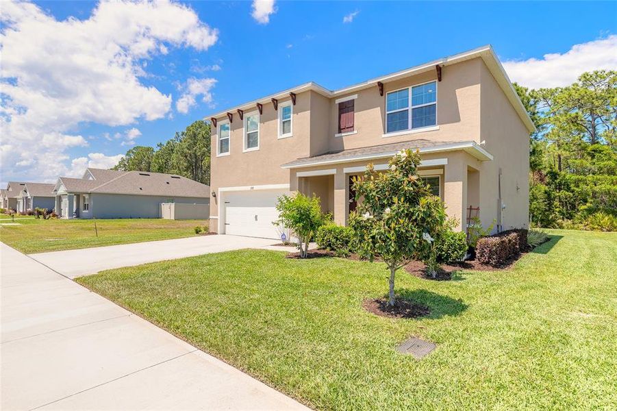 Front exterior of a new home in Fountain View, Ormond Beach, FL, highlighting curb appeal (Image 23).