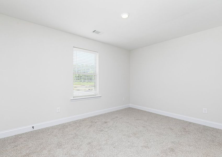 Each secondary bedroom includes walk-in closets. carpets and bright windows