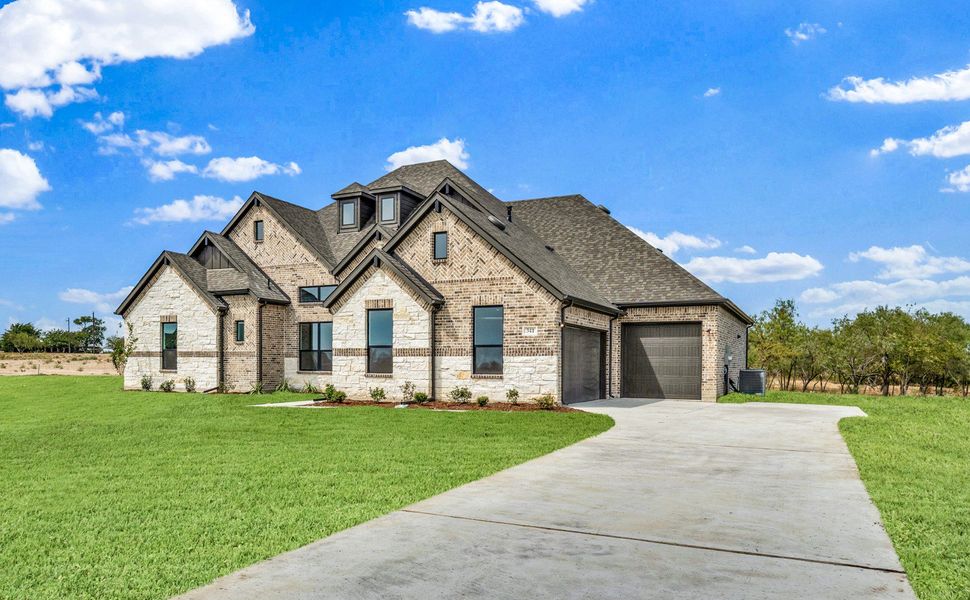 Front exterior of a new home in Legacy Trails, McLendon-Chisholm, TX, highlighting curb appeal (Image 16).