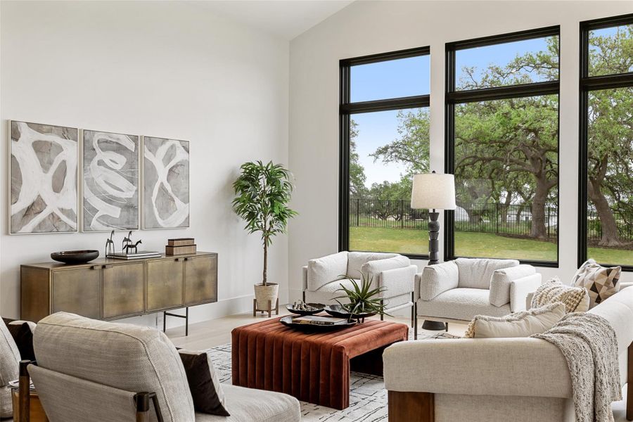 Living area featuring vaulted ceiling and wood finished floors Living area featuring vaulted ceiling and wood finished floors