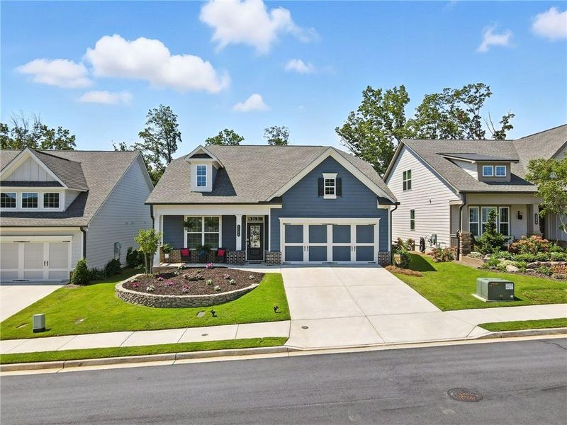 Front exterior of a new home in Hickory Bluffs, Canton, GA, highlighting curb appeal (Image 21). Front exterior of a new home in Hickory Bluffs, Canton, GA, highlighting curb appeal (Image 21).