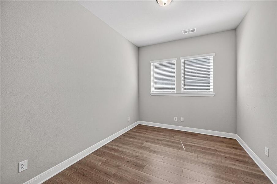 Neutral wall tones complemented by wood-finish flooring Neutral wall tones complemented by wood-finish flooring