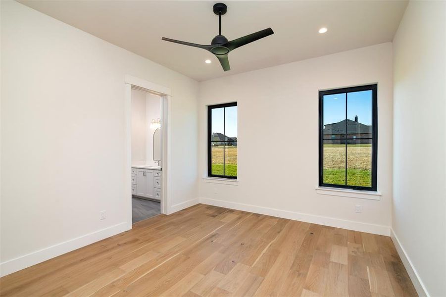 Spare room with light hardwood / wood-style floors and ceiling fan