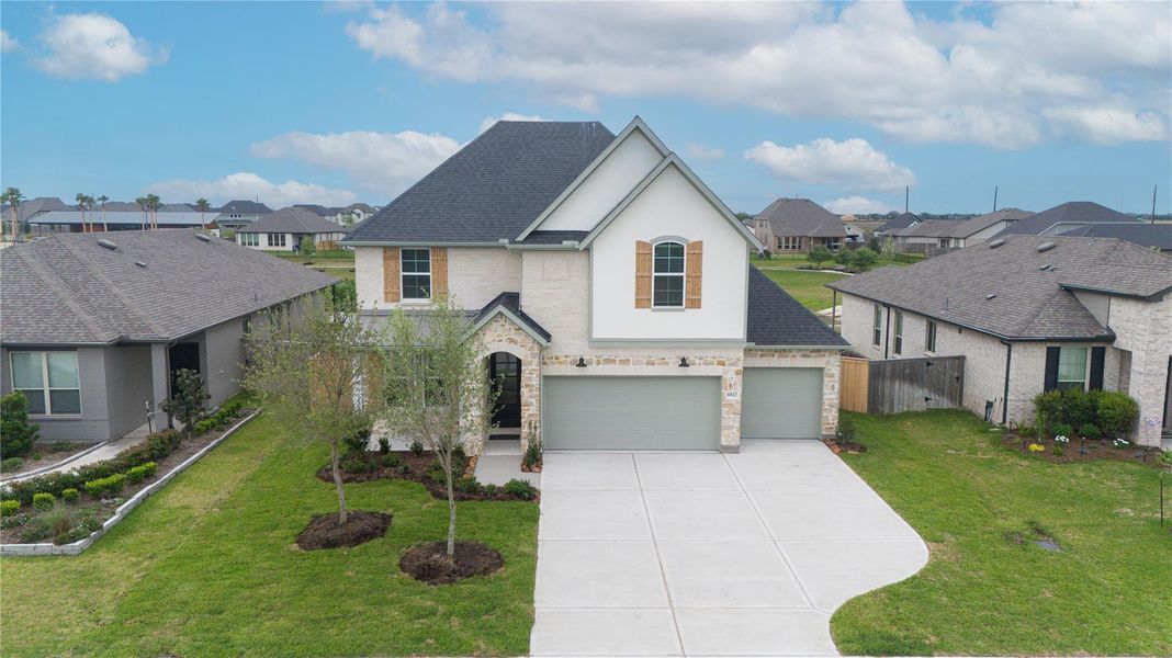Front exterior of a new home in , Richmond, TX, highlighting curb appeal (Image 25). Front exterior of a new home in , Richmond, TX, highlighting curb appeal (Image 25).
