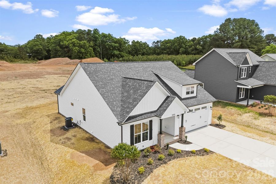 Front exterior of a new home in , Albemarle, NC, highlighting curb appeal (Image 23).