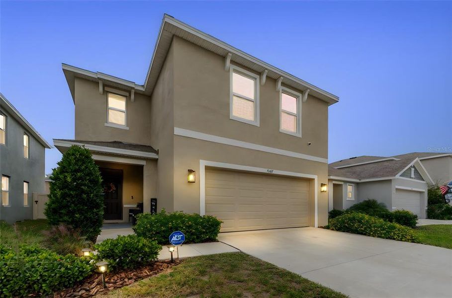 Front exterior of a new home in Westgate at Avalon Park, Wesley Chapel, FL, highlighting curb appeal (Image 28).