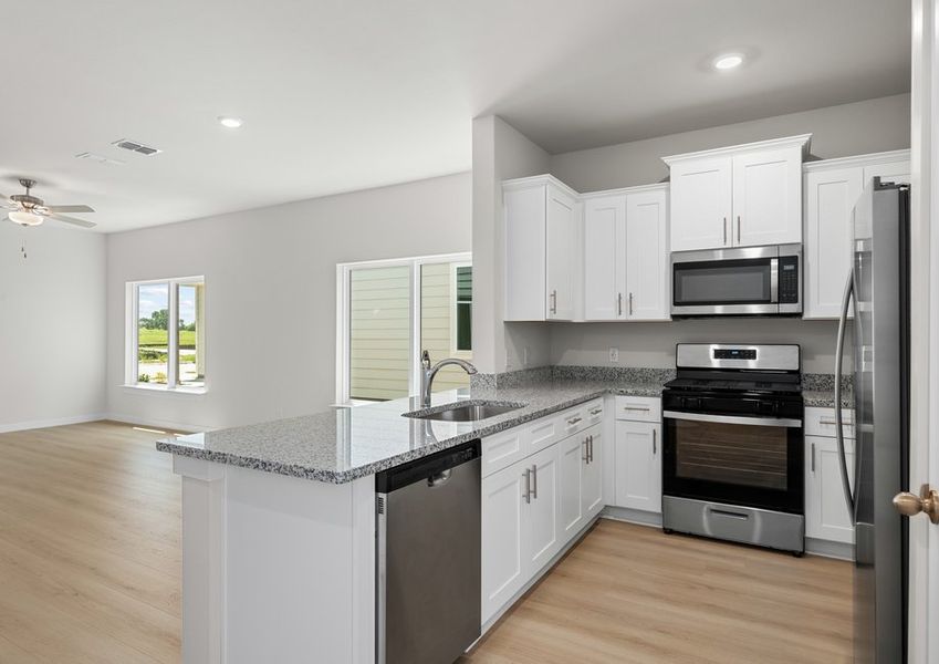 Beautiful kitchen overlooks spacious living room Beautiful kitchen overlooks spacious living room