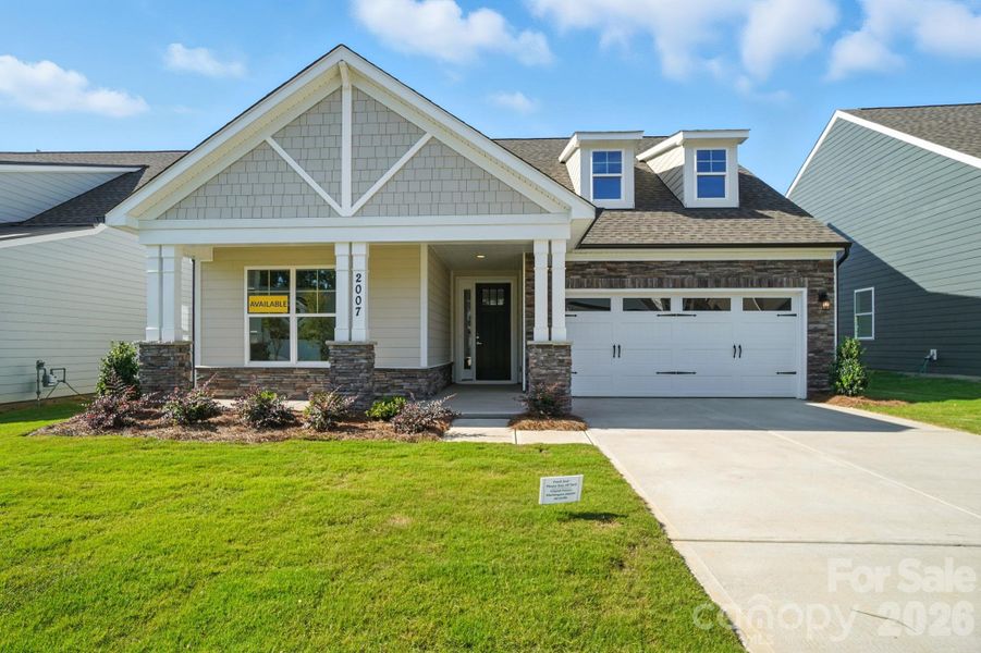 Front exterior of a new home in Heritage - 55+ Community, Indian Trail, NC, highlighting curb appeal (Image 21).