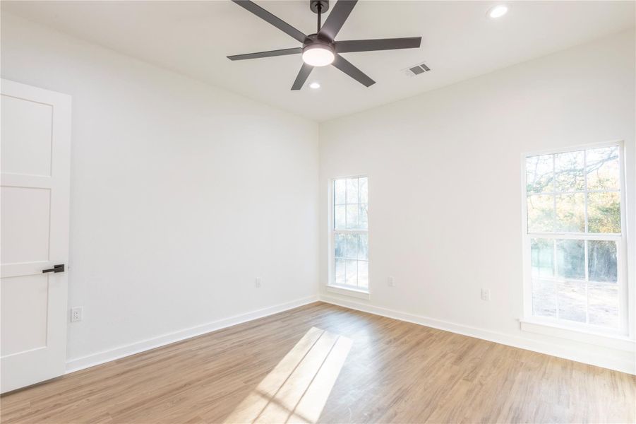 Additional angle of the master bedroom from the closet doorway.
