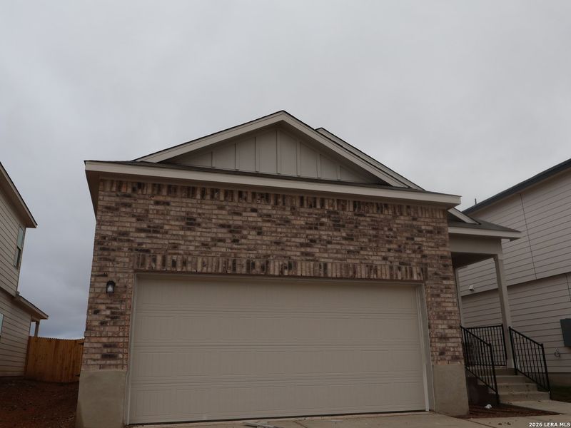 Front exterior of a new home in Park Place, New Braunfels, TX, highlighting curb appeal (Image 17).
