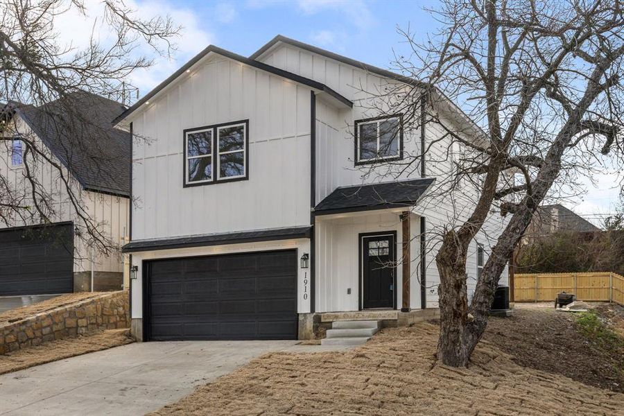 View of front of home featuring a garage