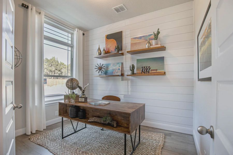 Representative furnished interior of a home built from the Lincoln by Chesmar Homes in Buffalo Crossing, Cibolo (Image 7).