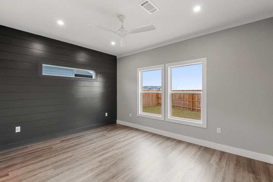 Primary bedroom easily fits a king size bed