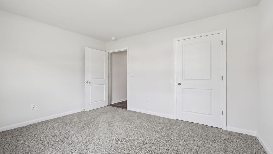 Spacious, unfurnished interior of a new home in Bentley Park, Greenwood (Image 15).