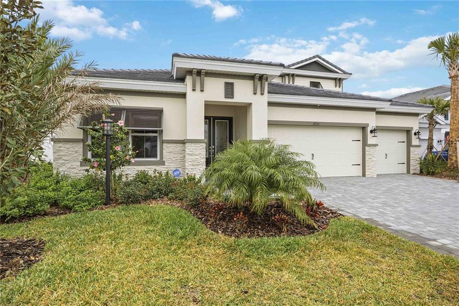 Front exterior of a new home in , Lakewood Ranch, FL, highlighting curb appeal (Image 26). Front exterior of a new home in , Lakewood Ranch, FL, highlighting curb appeal (Image 26).