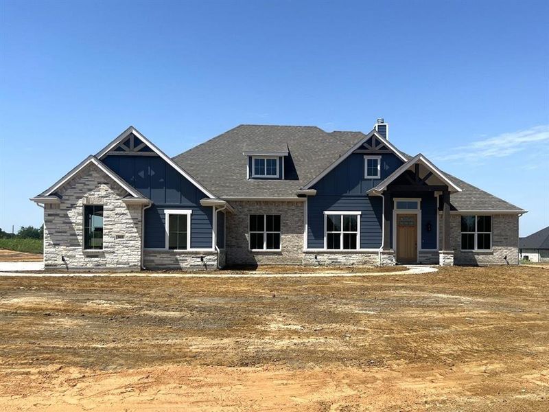 Front exterior of a new home in Hidden Creek Estates, Van Alstyne, TX, highlighting curb appeal (Image 1). Front exterior of a new home in Hidden Creek Estates, Van Alstyne, TX, highlighting curb appeal (Image 1).